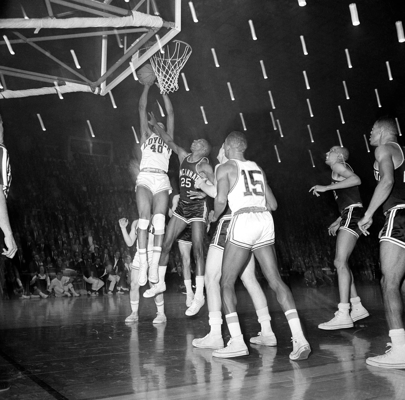 Loyola’s Vic Rouse winning the Ramblers the 1963 national title with a last-second tip-in.